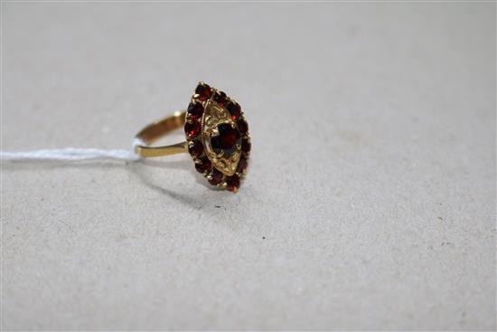 An 18ct gold and garnet set marquise cluster ring, size N.